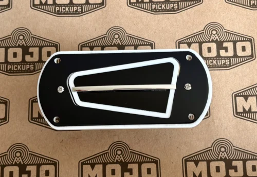 Close-up of a black electric guitar pickup with a chrome frame and screws, resting on MOJO Pickups branded cardboard packaging.
